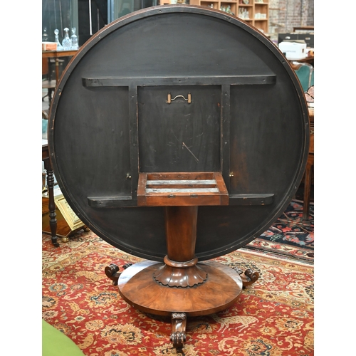 828 - A Victorian style radially veneered flame mahogany breakfast table, the circular tilt top raised on ... 