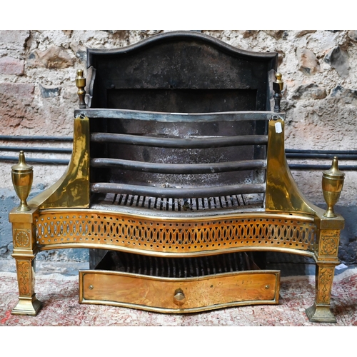 882 - A large George III style brass and cast iron fire grate, of serpentine form, 77 cm w x 66 cm h o/all... 