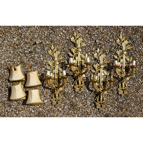 973 - A set of four ormolu twin branch wall  sconces/light fittings, with oakleaf, sword and ribbon bow de... 