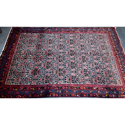 727 - A contemporary North West Persian Afshar carpet, the repeating floral design on camel ground, 250 cm... 