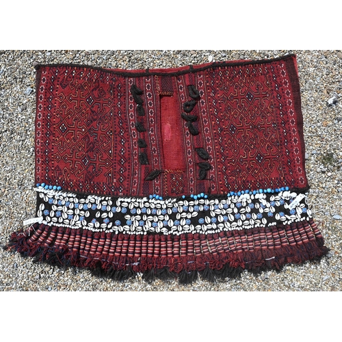 761 - A vintage Afghan shell mounted rug double saddle bag, with kelim back and heavy braided tassels, 135... 