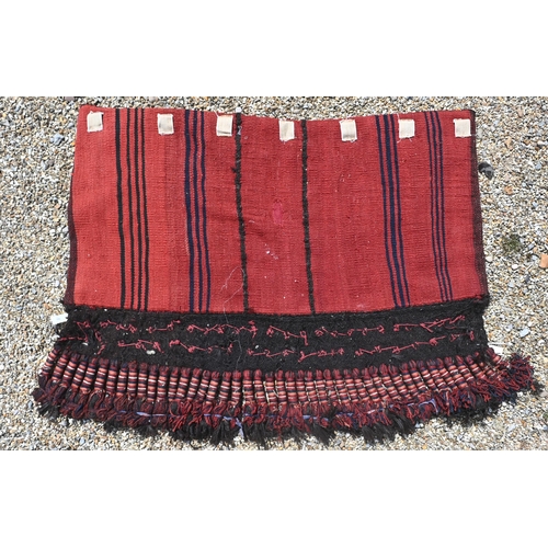 761 - A vintage Afghan shell mounted rug double saddle bag, with kelim back and heavy braided tassels, 135... 