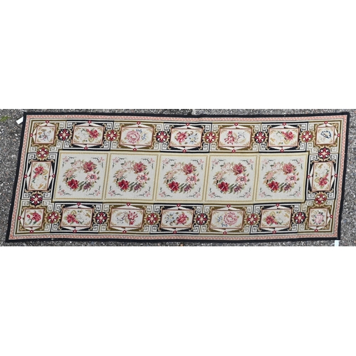 762 - A traditional Aubusson needlepoint panel, the tile design with floral motifs, 220 cm x 89 cm