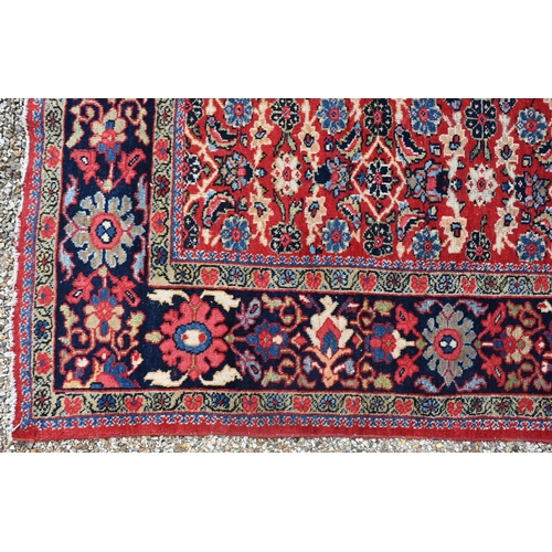 764 - An antique Persian Mahal carpet, the blue ground with all-over floral garland design, 300 cm x 200 c... 