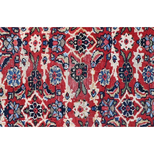 764 - An antique Persian Mahal carpet, the blue ground with all-over floral garland design, 300 cm x 200 c... 