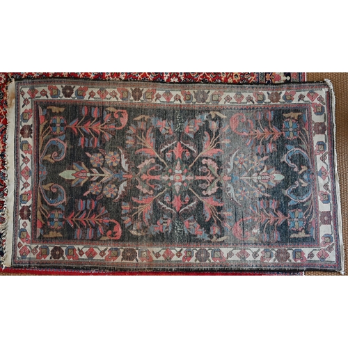 728 - An old Persian Hamadan rug, 1st half 20th century, the dark blue ground with stylised floral design,... 