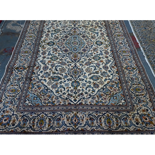 747 - A central Persian Kashan carpet, the pale camel ground centred by a floral medallion and garden desi... 
