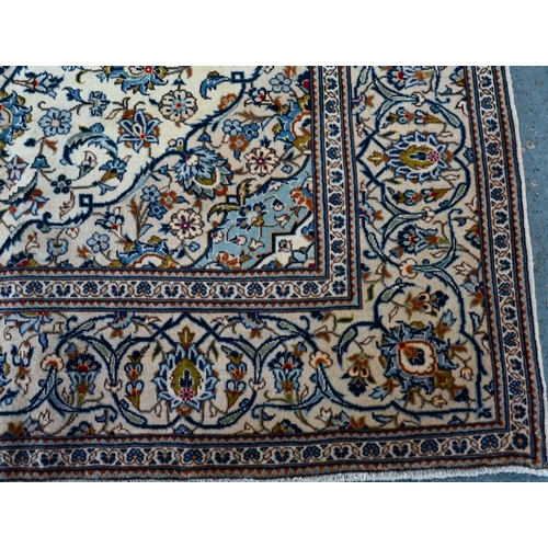 747 - A central Persian Kashan carpet, the pale camel ground centred by a floral medallion and garden desi... 