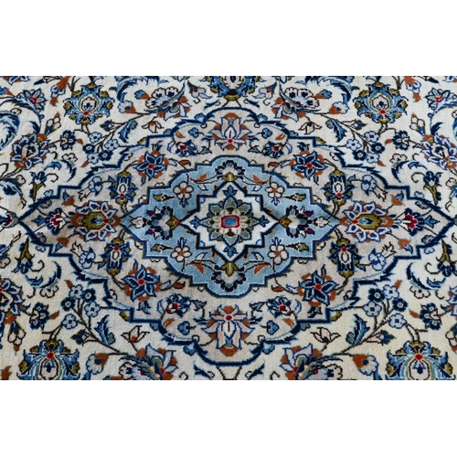 747 - A central Persian Kashan carpet, the pale camel ground centred by a floral medallion and garden desi... 