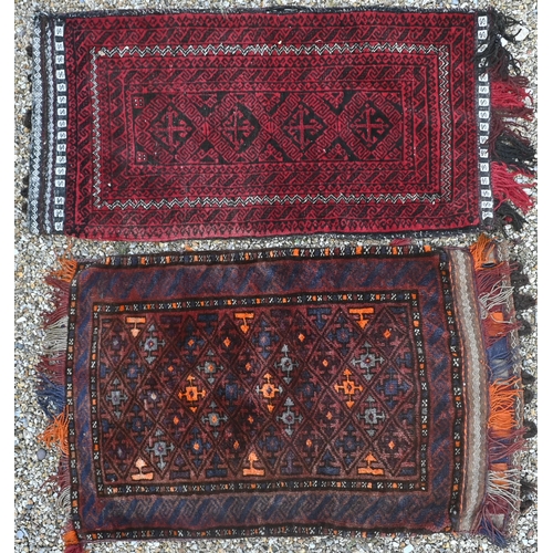 766 - Two mid-century Afghan/Belouch carpet faced saddle bags, with kelim backs, 99 cm x 68 cm and 111 cm ... 