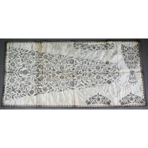 1021 - A Sicilian idol shawl, profusely embroidered with silver wire/metalised threads and sequins, 52 x 10... 