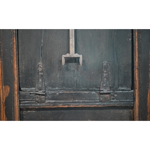 832 - A 17th century Welsh oak box settle, the crest rail with lunette carved decoration over further carv... 