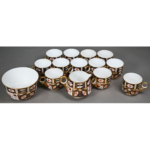 542 - A Royal Crown Derby Imari tea service comprising twelve each cups, saucers and plates, to/w sandwich... 