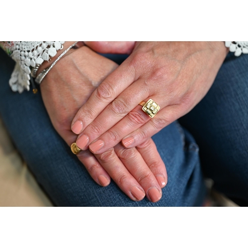 206 - An 18ct yellow gold ring with square 'cross' motif, 1.2 x 1.2cm, size L 1/2, approx 10g