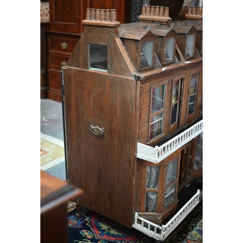 977 - A large late Victorian three-storey villa doll's house with double-bay front, 119 cm high x 100 cm w... 