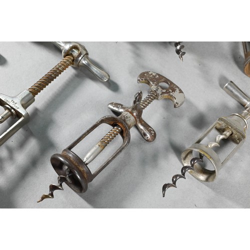 955 - Four Victorian corkscrews with turned wood handles, to/w three 19th century metal corkscrews and a s... 