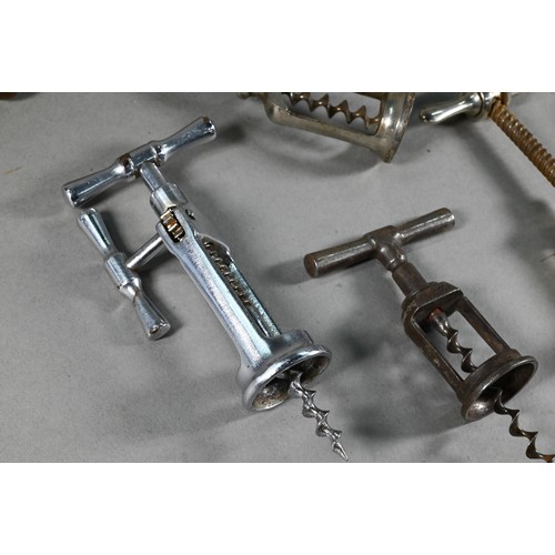 955 - Four Victorian corkscrews with turned wood handles, to/w three 19th century metal corkscrews and a s... 