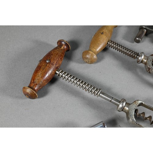 955 - Four Victorian corkscrews with turned wood handles, to/w three 19th century metal corkscrews and a s... 