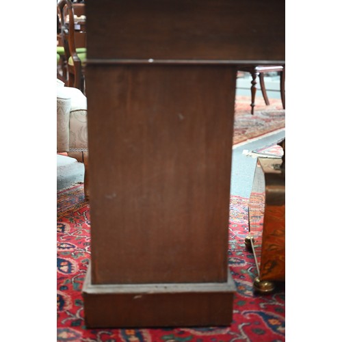 874 - A Victorian walnut twin pedestal desk, the inset tan leather top over an arrangement of moulded edge... 