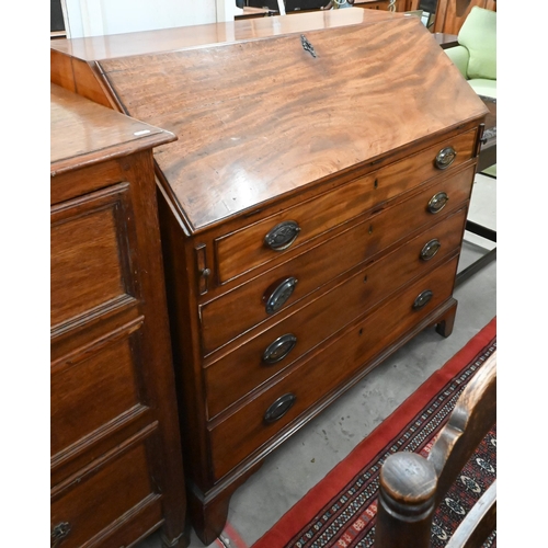 95 - # A George III mahogany fall-front bureau with fitted interior over four long graduating drawers rai... 