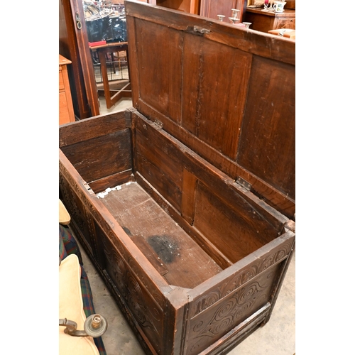 125 - # An antique carved oak coffer/blanket chest of panelled construction, 126 cm wide x 58 cm deep x 65... 