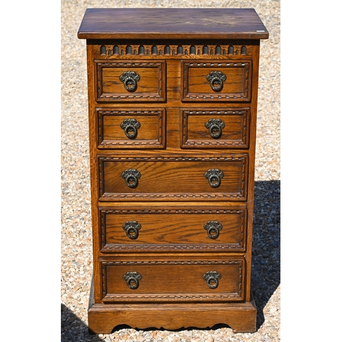 187 - Wood Bros. Ltd, a reproduction oak seven drawer hall chest, 56 cm x 38 cm x 101 cm h