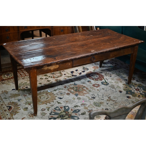 249 - An antique Italian provincial fruitwood farmhouse table, with frieze drawer to one side, raised on s... 