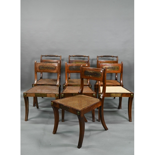 254 - A set of five Regency brass inlaid mahogany caned seat side chairs with sabre front legs to/w four o... 