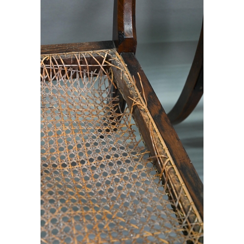 254 - A set of five Regency brass inlaid mahogany caned seat side chairs with sabre front legs to/w four o... 