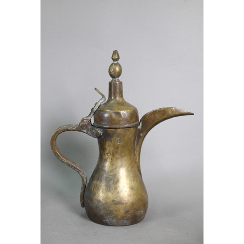 432 - A collection of Asian Middle-Eastern metal wares including a white metal embossed scroll/document ho... 