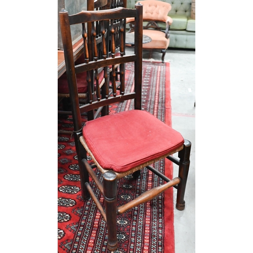 103 - A set of eight ash Lancashire spindleback chairs with rush seats, (two carvers and six standard) (8)