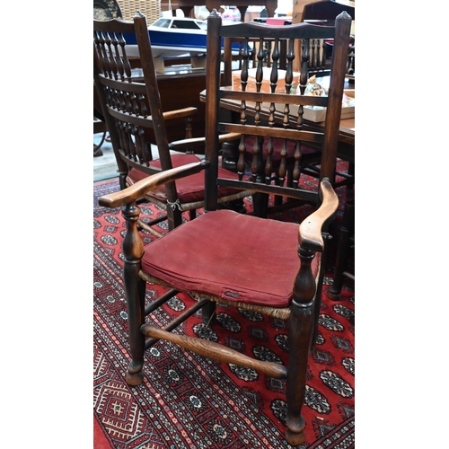 103 - A set of eight ash Lancashire spindleback chairs with rush seats, (two carvers and six standard) (8)