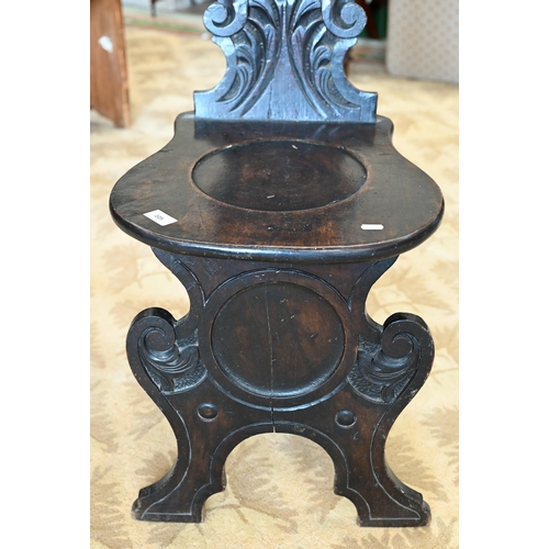 105 - A Victorian 'Green man' carved hall chair