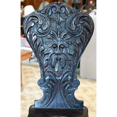 105 - A Victorian 'Green man' carved hall chair