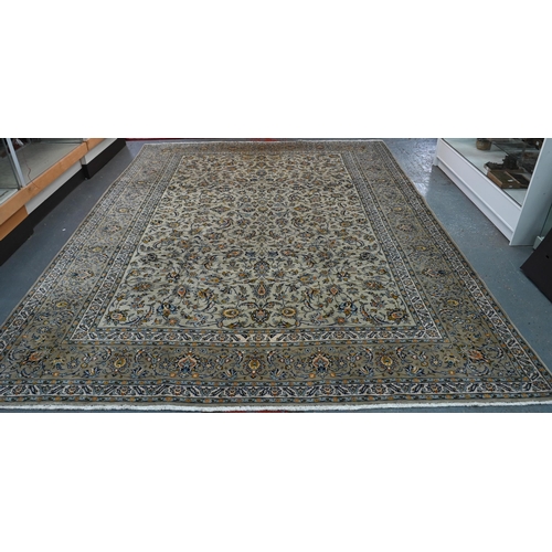 108 - A Persian cream ground Kashan carpet of tradiitonal stylised floral design, with palmette repeating ... 