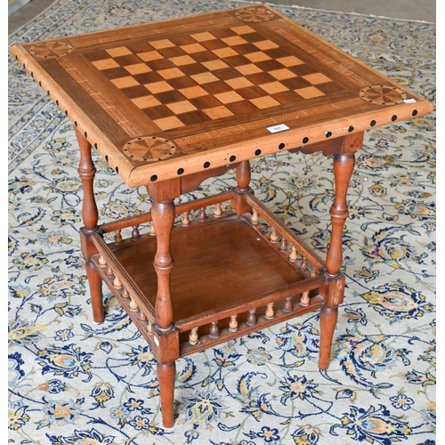 109 - A hardwood marquetry square games table with turned supports and undertier, 65 x 65 x 72 cm high