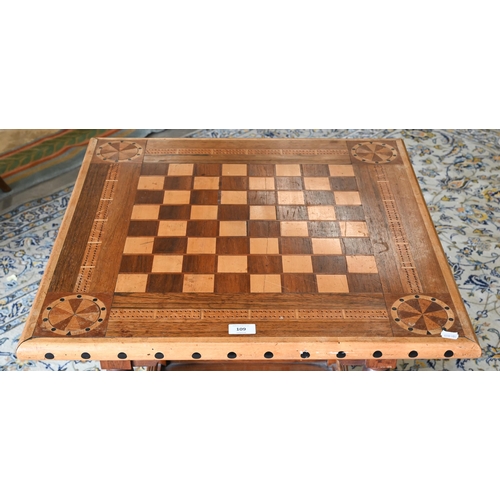 109 - A hardwood marquetry square games table with turned supports and undertier, 65 x 65 x 72 cm high