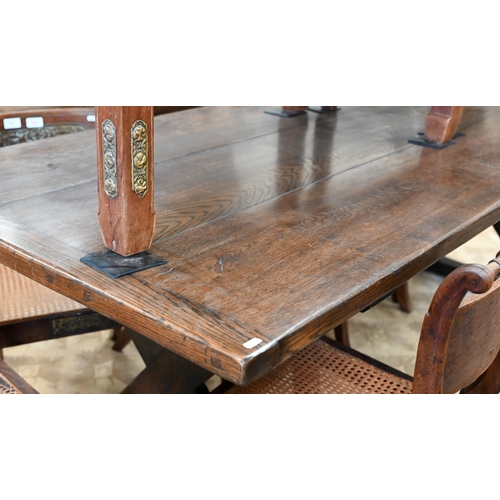 110 - An oak refectory dining table with cleated triple plank top on braced cross-trestle supports, 230 x ... 