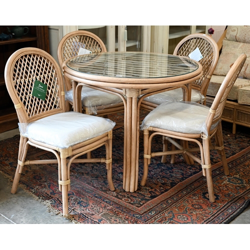 111 - Kings Worthy Foundry ex stock - A Daro Bistro cane and rattan glass topped dining table and four cha... 