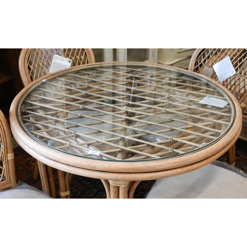 111 - Kings Worthy Foundry ex stock - A Daro Bistro cane and rattan glass topped dining table and four cha... 