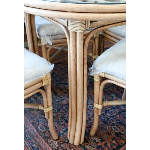 111 - Kings Worthy Foundry ex stock - A Daro Bistro cane and rattan glass topped dining table and four cha... 