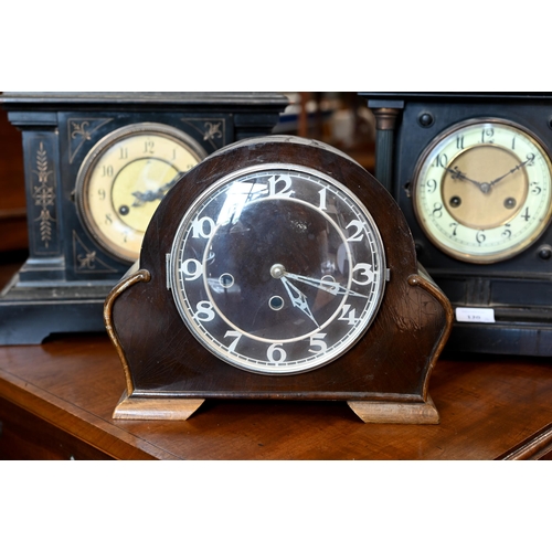 120 - Two late 19th century architectural ebonised mantle clocks to/w a 1930s triple train clock (3)