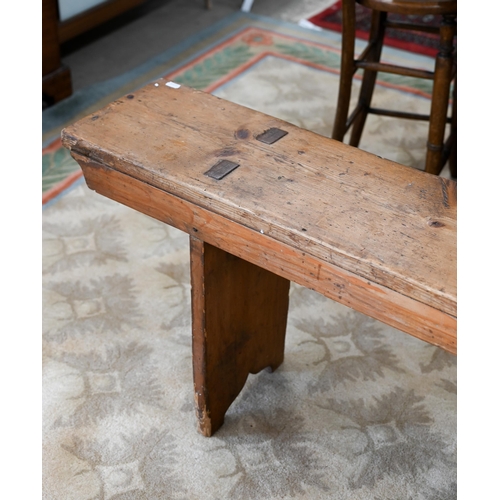 121 - A pair of antique stained pine benches, 250 cm long x 48 cm high