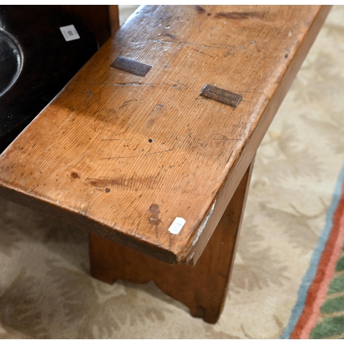 121 - A pair of antique stained pine benches, 250 cm long x 48 cm high