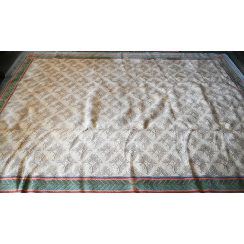 122 - A Stockwell Carpets wool carpet (made in Thailand) of repeating design on beige ground framed by mul... 