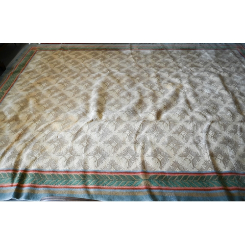 122 - A Stockwell Carpets wool carpet (made in Thailand) of repeating design on beige ground framed by mul... 