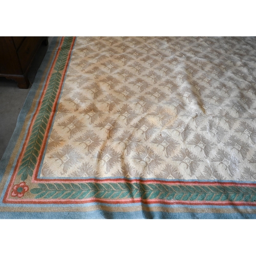 122 - A Stockwell Carpets wool carpet (made in Thailand) of repeating design on beige ground framed by mul... 