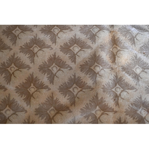 122 - A Stockwell Carpets wool carpet (made in Thailand) of repeating design on beige ground framed by mul... 