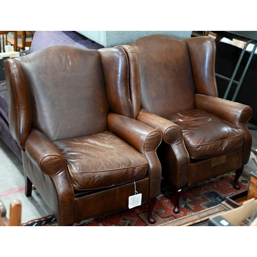 124 - A pair of brown leather Laura Ashley recliner wingback armchairs (2)