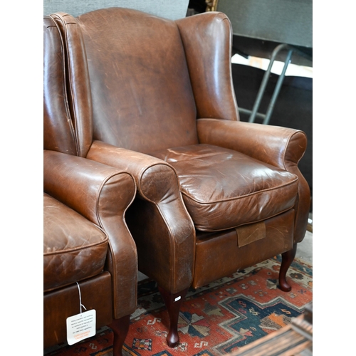 124 - A pair of brown leather Laura Ashley recliner wingback armchairs (2)